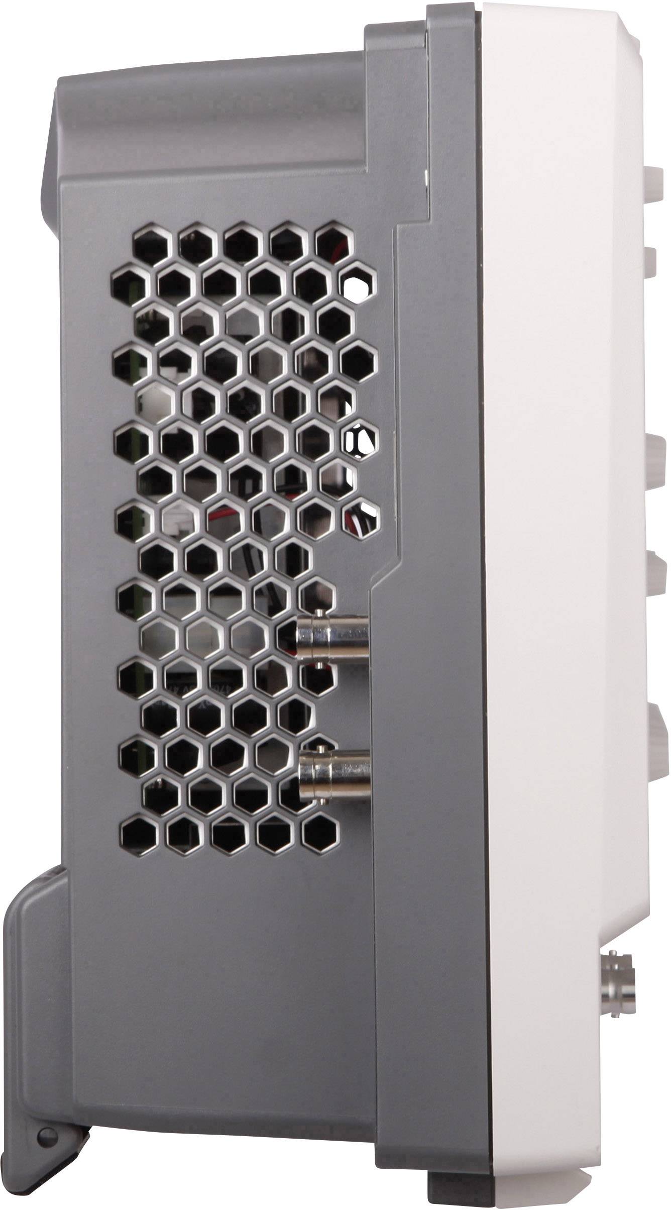 Side view of an electronic device with a grey plastic casing and a honeycomb-style ventilation grille, showing connections on the rear panel.