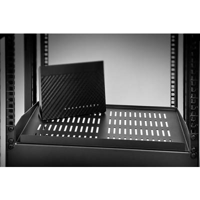 A black router with ventilation slots sits on a shelf in a server rack, against a neutral background.