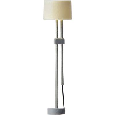Floor lamp with a cylindrical, cream-coloured lampshade and a slender, grey metal base; simple modern design.