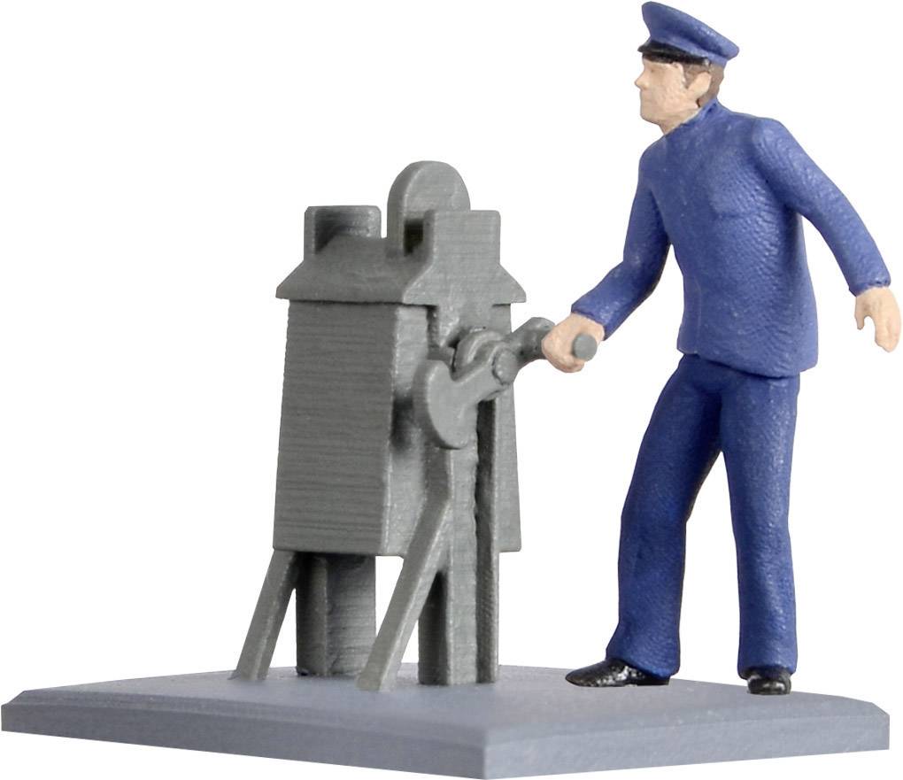 A figure in a blue uniform is operating a grey machine.