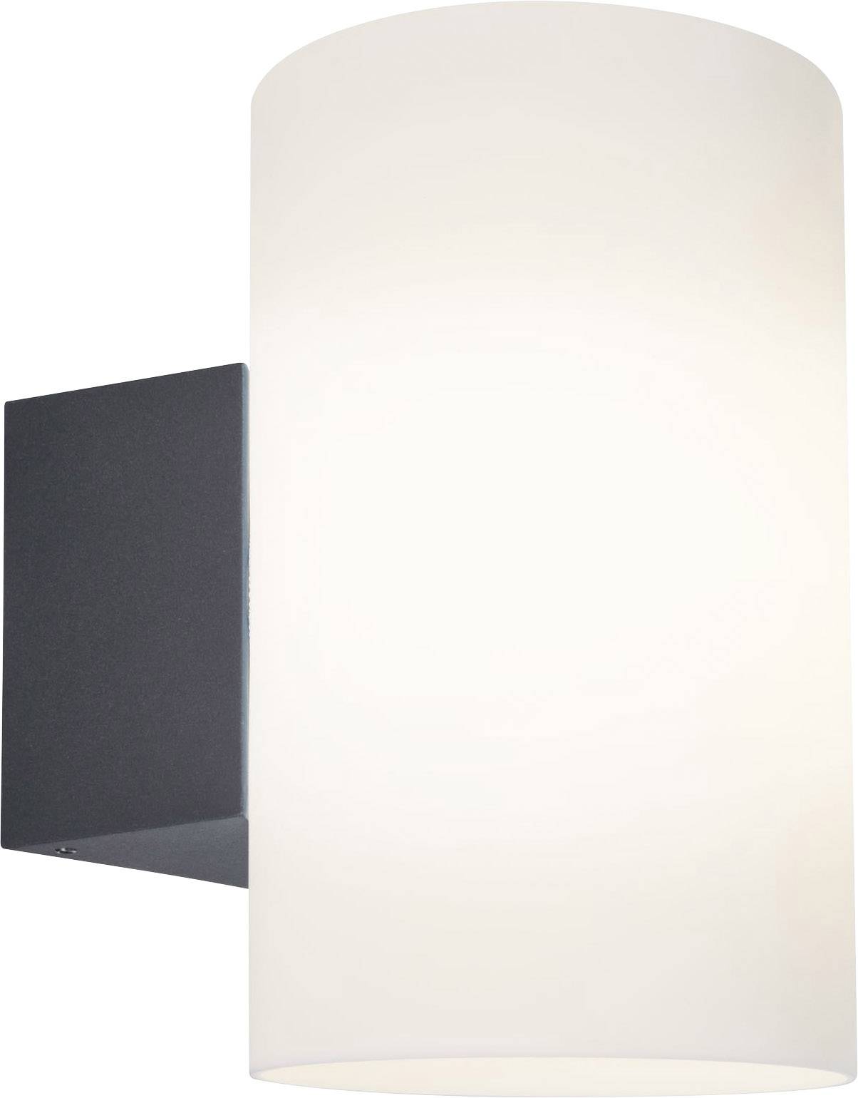 A modern wall light with a black base and white, cylindrical glass shade. It emits soft, diffused light.