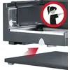 Close-up of a coffee machine. A warning symbol with a pictogram shows a person operating the lever in the safety zone.