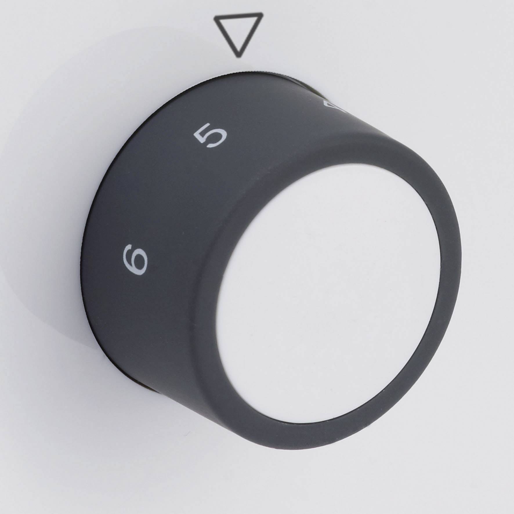 A grey rotary dial with numbers 5 and 6, pointing to a triangular symbol, likely for adjusting a device.