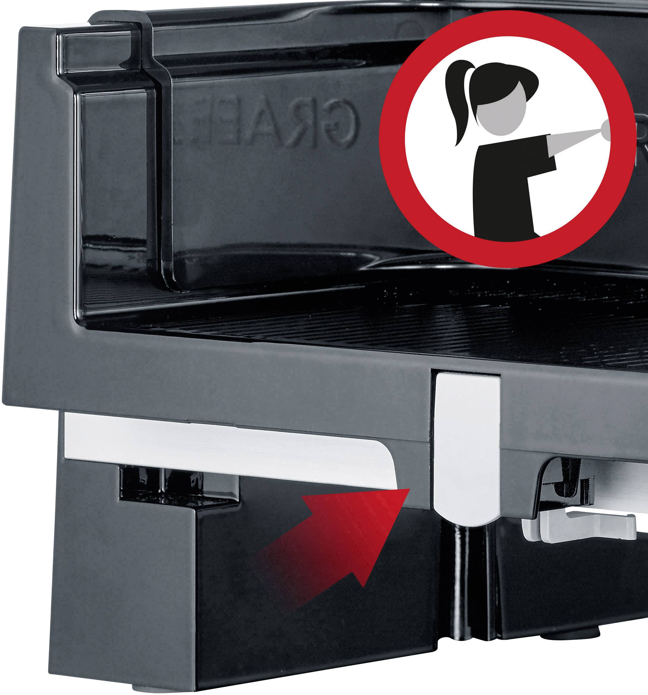 Part of a machine with a warning symbol. The symbol depicts a stylised person with a raised hand. An arrow indicates caution.