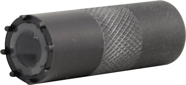 A black cylindrical metal pin with a ribbed pattern and a smooth end is resting on a white surface.