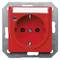 Red electrical socket with earth pin and cover. Brand name visible at the top. Used for electrical connections with earthing protection.