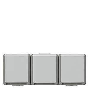 Three square, grey switches positioned side by side on a white wall.