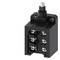 A black electrical component with screw terminals, likely a switch or distribution board, is visible in close-up.