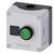 A square Siemens housing with a green button and grey surface. Likely serves as a control switch.