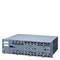 A grey network switch with multiple Ethernet ports and control elements indicating professional use.