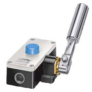 Safety limit switch with long lever arm and blue push button, used in industrial installations for position monitoring.