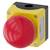 Large red emergency stop switch on a yellow housing, used for safety shut-offs in industrial installations.