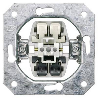 Close-up of a metal electrical switch socket with four connection terminals in different colours.