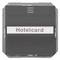 Black card holder with the inscription 'Hotelcard', built into a wall, likely used to control electricity in hotel rooms.