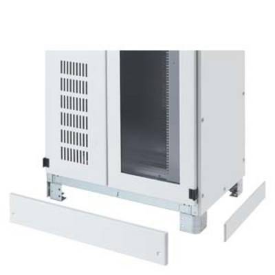 A half-assembled white device or cabinet with metal legs and removed panels, likely for electronic equipment.