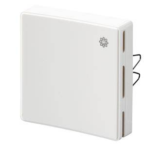A white, square sensor with a subtle flower design on its top surface. It has side ventilation slots and is mounted on a wall.