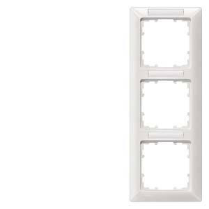 A triple white frame for light switches with empty recesses for mounting, vertically aligned.