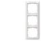 A triple white frame for light switches with empty recesses for mounting, vertically aligned.