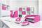Modern furnished office with white furniture, pink accent items such as folders and staplers, laptop on the table.