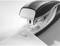 A silver stapler secures a single sheet of paper with a staple on a white surface.