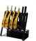 A set of ESD tools, comprising pliers and tweezers, with yellow and black handles, sits in a black tool holder.