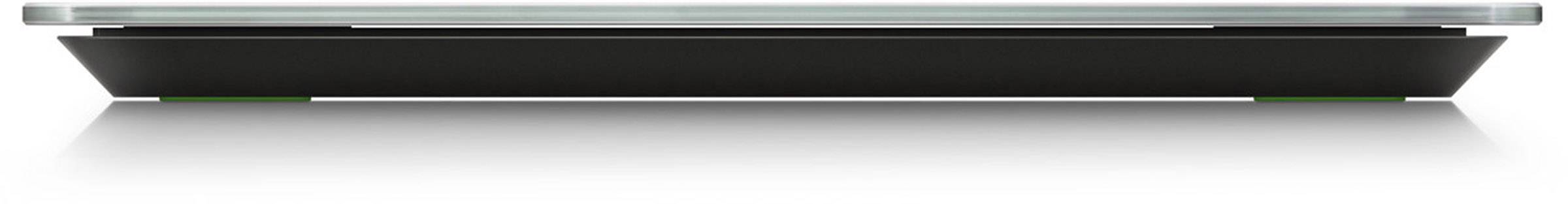 A flat, rectangular, black box with a transparent glass lid casting shadows on a reflective surface.