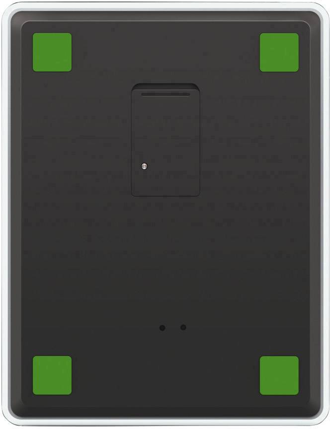 Black rectangular device with four green corners and a central recess. Potential underground sensor or electronic unit.