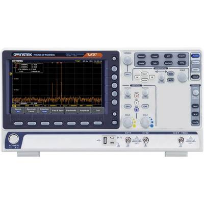 An oscilloscope displays a graphical spectral analysis on a screen with various buttons and rotary knobs for operation.