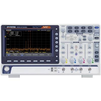 Oscilloscope with colour display showing frequency spectrum analysis. Device front panel with numerous control elements for measurement and analysis functions.