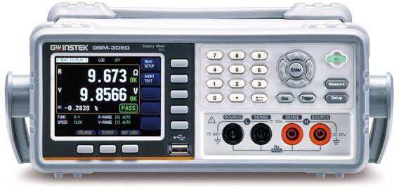 A digital battery measuring device displays precise measurement values for voltage (9.673 V) and resistance (9.8566 Ω) on a colour display.