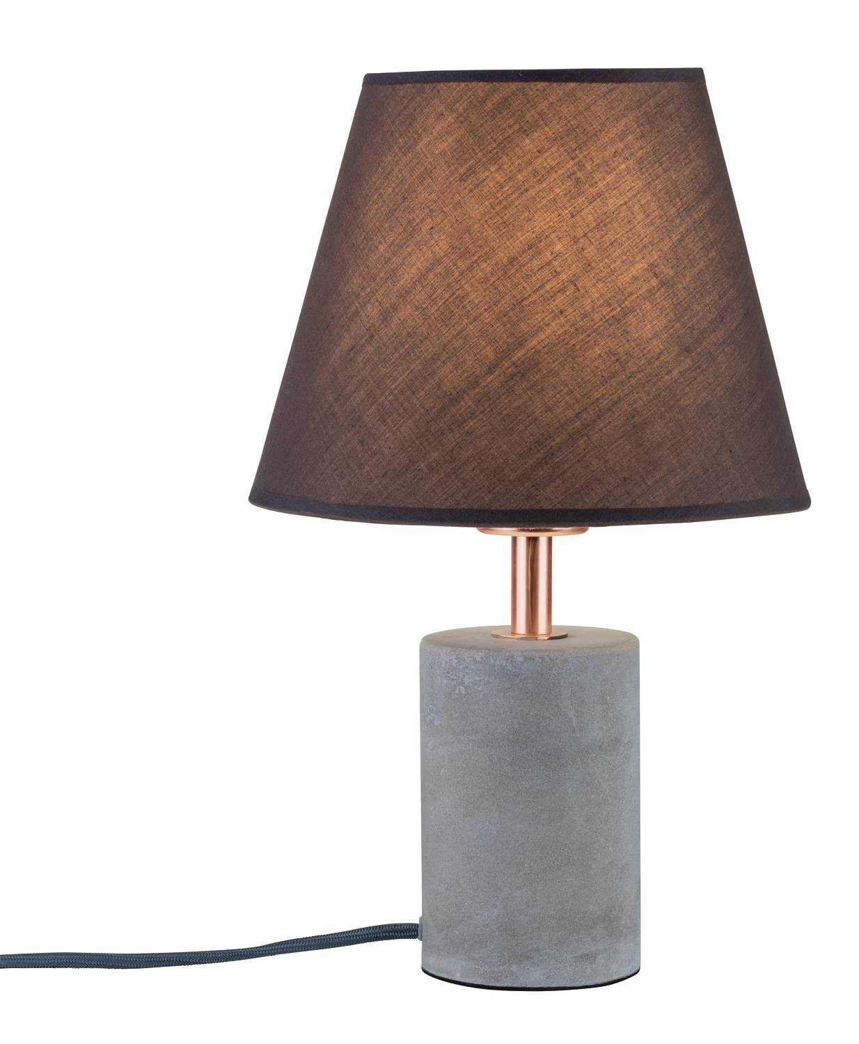 A table lamp with a black shade and a cylindrical concrete base, switched on and illuminating.