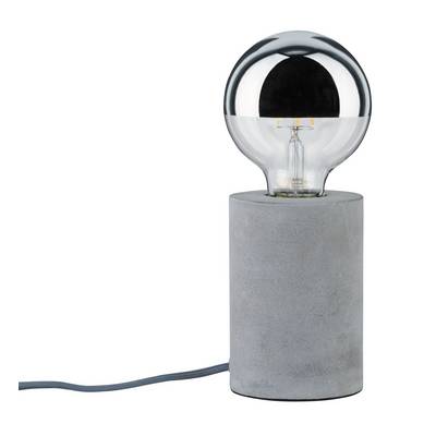 A light bulb sits on a cylindrical concrete base. A cable leads away from the base.
