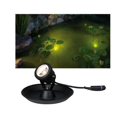 A pond at night with illuminated water lilies. In the foreground, a waterproof pond lamp is depicted.
