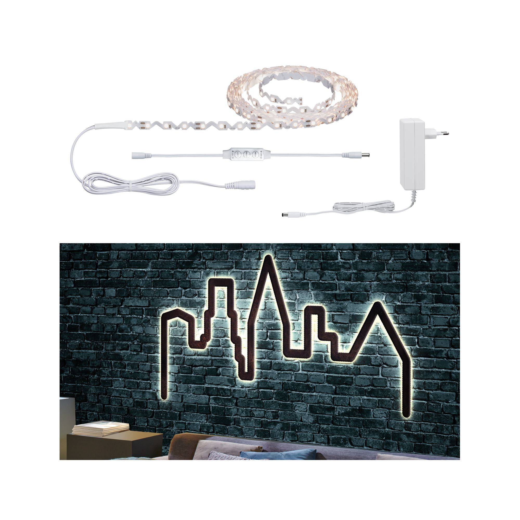 Fairy light set arranged on a wall behind a sofa, creating a city skyline silhouette against a brick background, a stunning feature in living spaces.