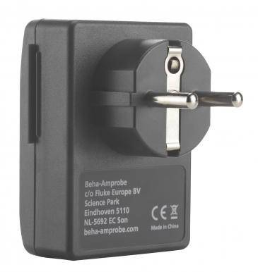 A black power supply with European plug type. Inscription: 'Beha-Amprobe, c/o Fluke Europe BV, Science Park, Eindhoven'.