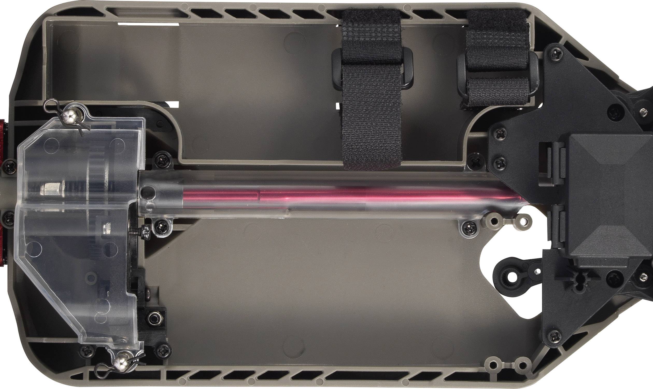 'Chassis of a remote-controlled car, showing the drivetrain as well as belts and screws.'