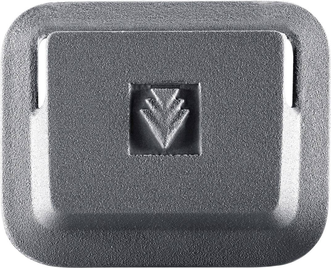 Grey, rectangular metal object with a central engraved arrow pattern pointing downwards.