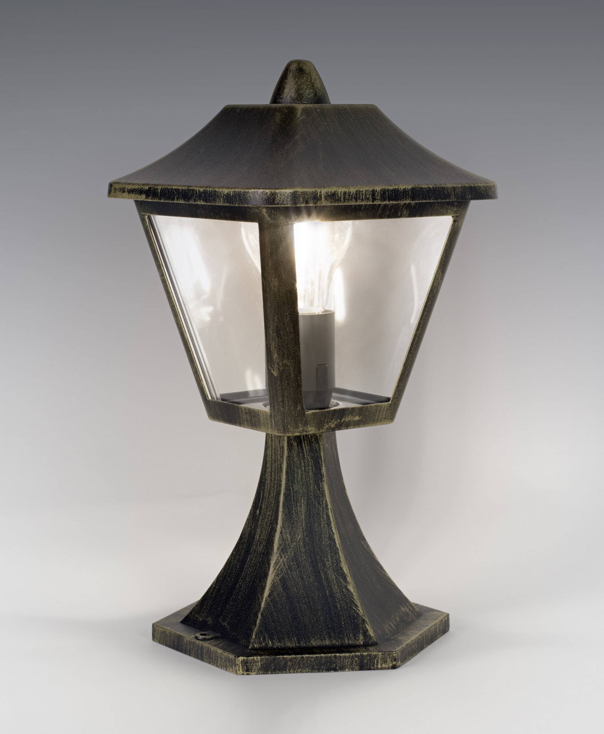 A black, antique lantern with a light bulb, emitting soft light. Ideal for classic-style outdoor areas.
