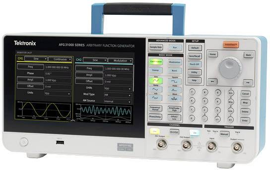 An arbitrary function generator with display shows waveforms and parameters. Controls and connectors are visible.