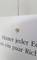 White sign on the wall with the sentence 'Behind every corner, a few directions are hiding'.