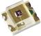 LED component with a square shape, transparent casing, and visible chip in the centre, surrounded by metal contacts.