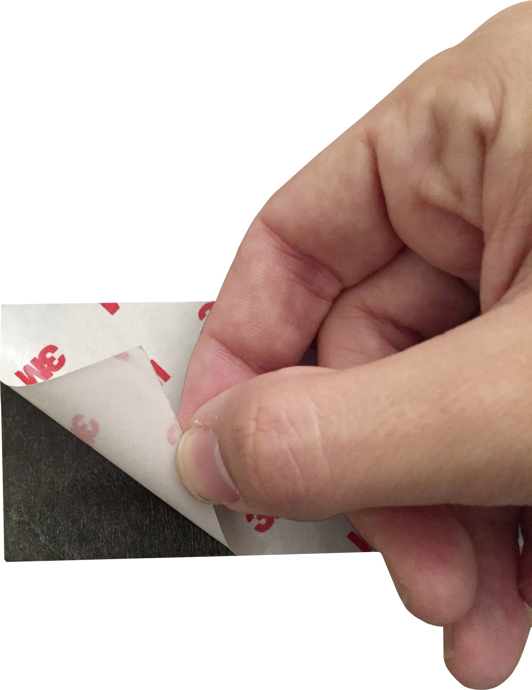 A hand peels the protective film off a double-sided adhesive tape.