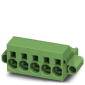 Green plastic plug, rectangular with six vertical connection openings and mounting wings on the sides.