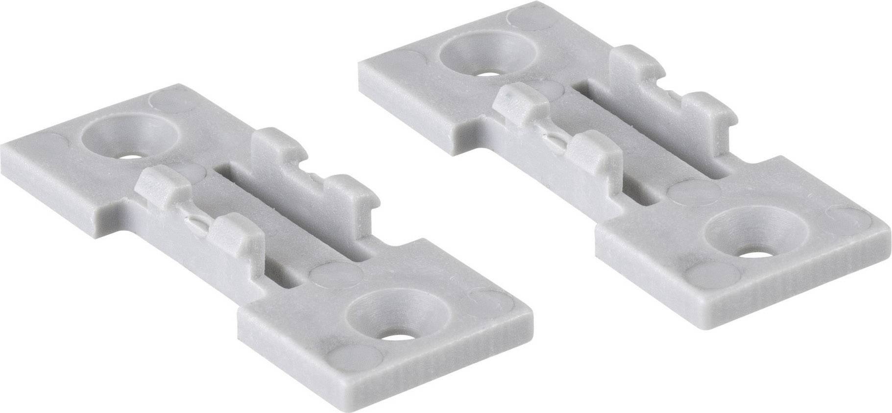 Two grey plastic mounting plates with drill holes, suitable for securing items to flat surfaces.