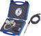 A blue suitcase with foam lining contains cables, a sensor and a disk. Beside it lies another cable.