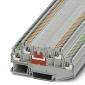 A grey terminal block with colour-coded connections for electrical wiring, used in control cabinets.