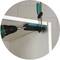 A shelf is secured to another surface using a metal bracket and a screw. A drill is used to screw in the screw.