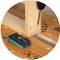 Wooden joint using wooden dowel technique demonstrated on a workbench. Tools and measuring instruments are being used.