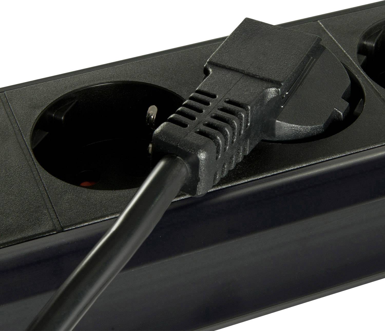 A black multi-socket extension with a power cable plugged into one of its sockets.