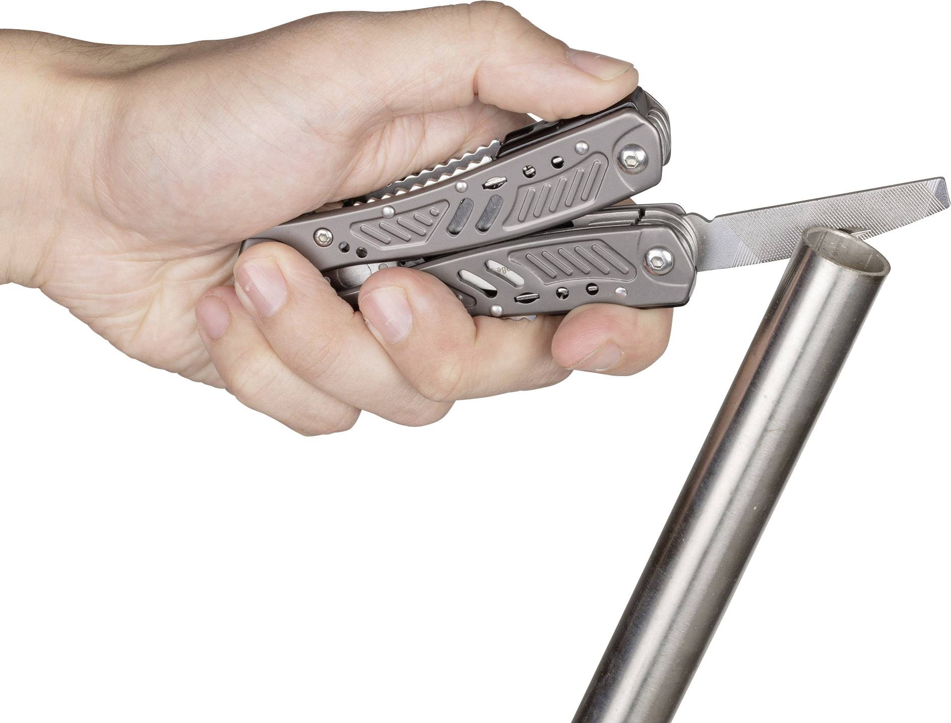 A hand is holding a multi-functional pocket tool with a file extended, which is pointed towards a metal pipe.